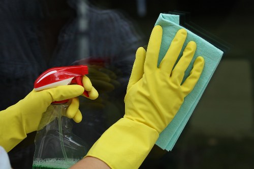 Close-up of baked-on grease being removed during oven cleaning