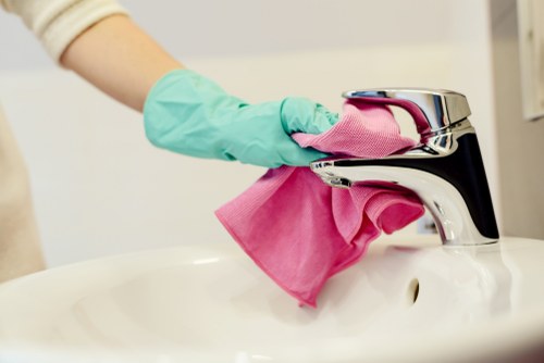 Final oven cleaning step with careful safety-focused workmanship