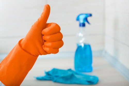Local cleaner working in a Sutton flat with careful access planning