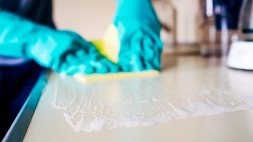 Local carpet cleaner preparing a room for cleaning in Sutton